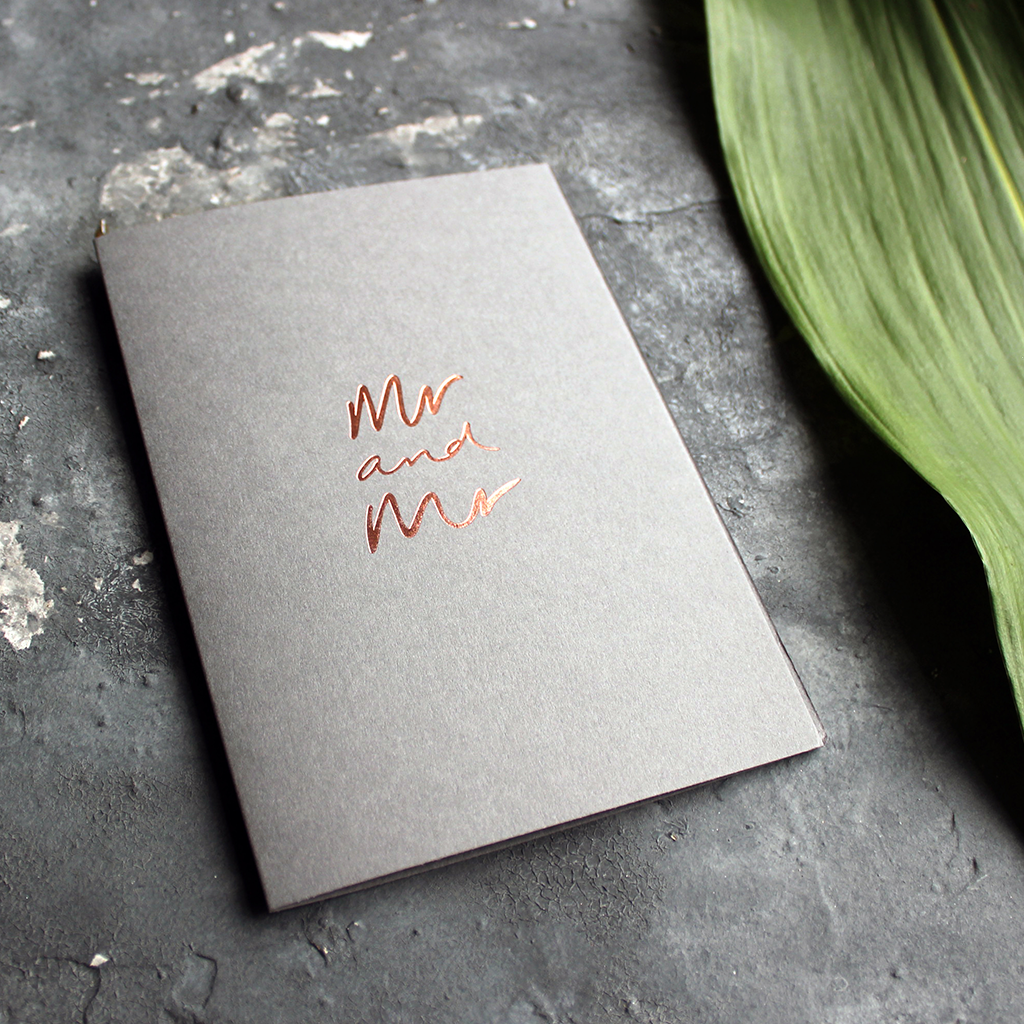 This luxury grey wedding card for the gay couple says Mr and Mr on the front, handwritten and hand foiled in rose gold