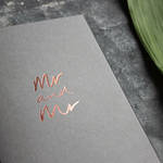 This luxury grey wedding card for the gay couple says Mr and Mr on the front, handwritten and hand foiled in rose gold